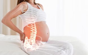 болить спина при вагітності причини